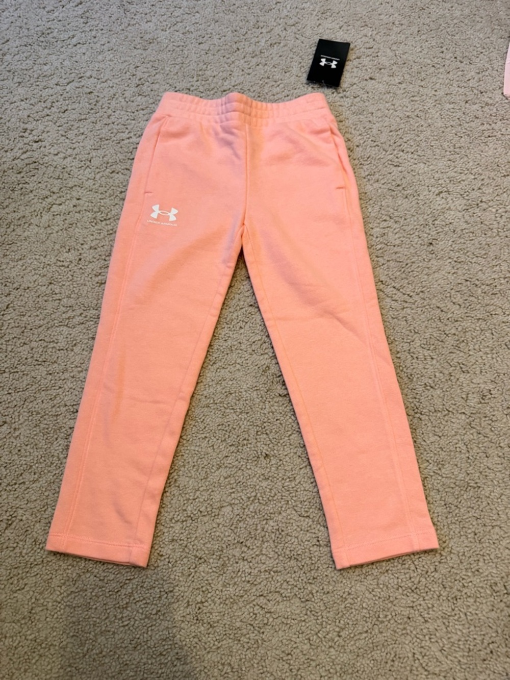 Under Armour Kids' coral color (orange-Pink) Fleece Joggers with pockets